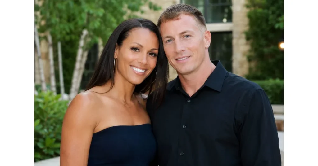 Denika Kisty standing beside her husband Jason Williams at a public event