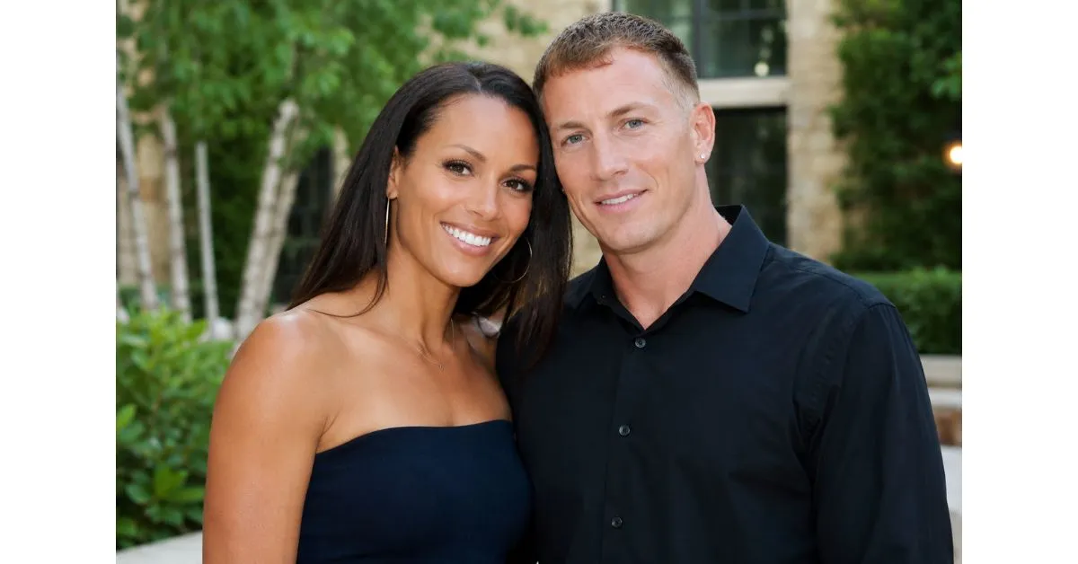 Denika Kisty standing beside her husband Jason Williams at a public event